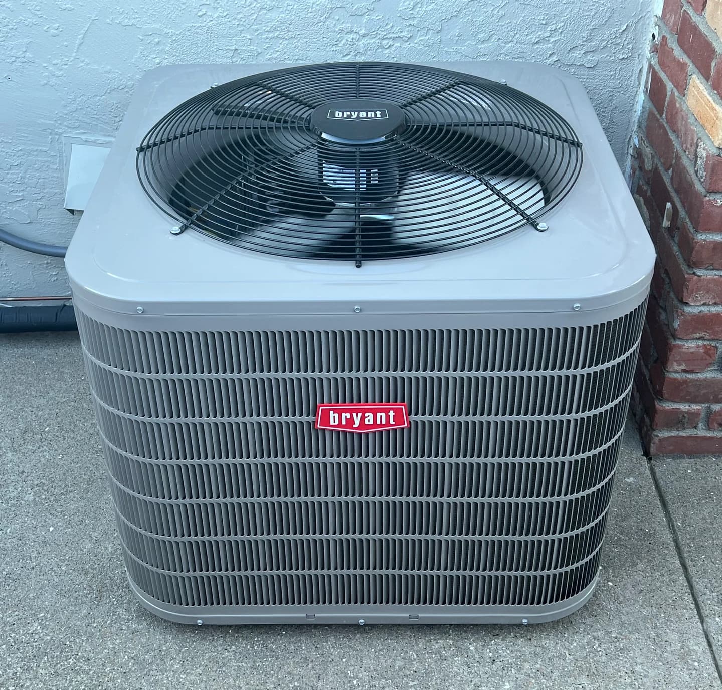 Photograph of an outdoor Bryant residential air-conditioning condenser